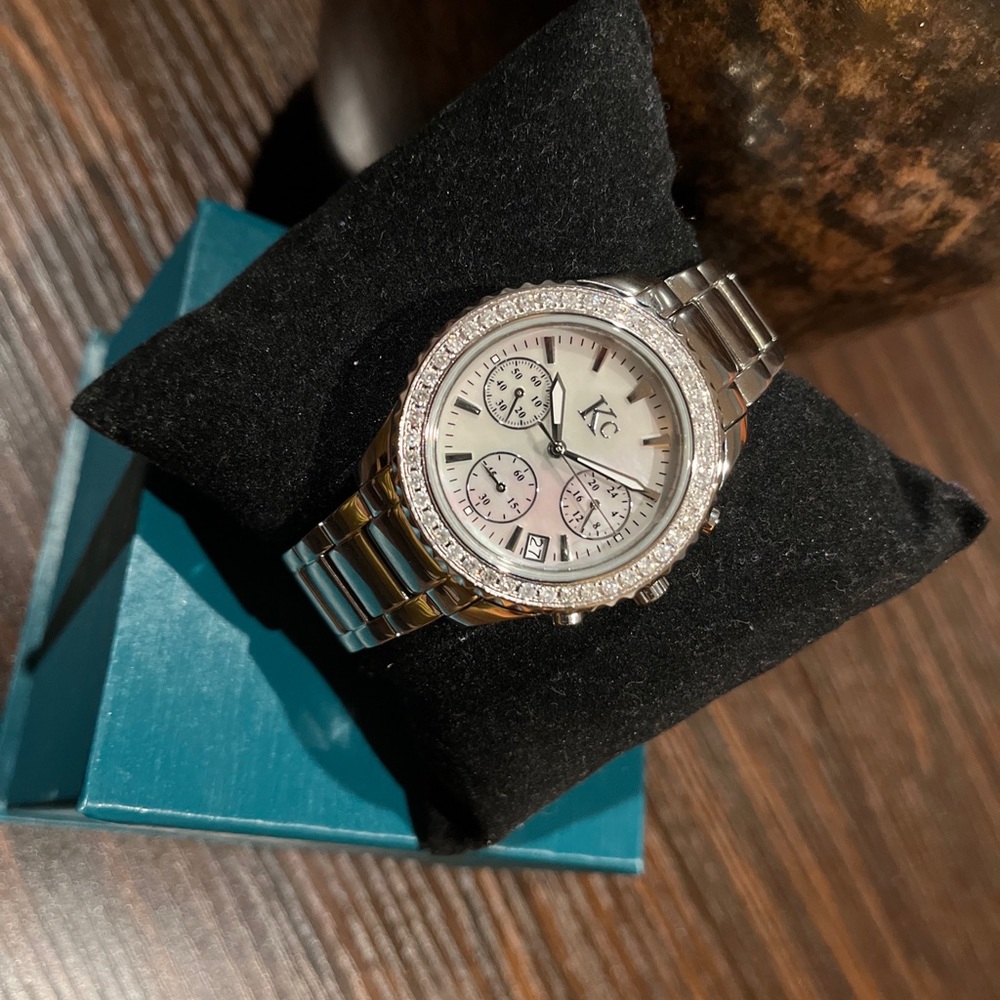 Kc Pearl dial Diamond bezel watch.
